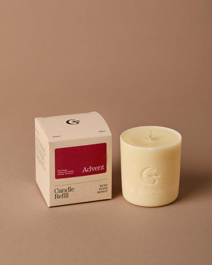 Candle refill and its packaging on a brown background