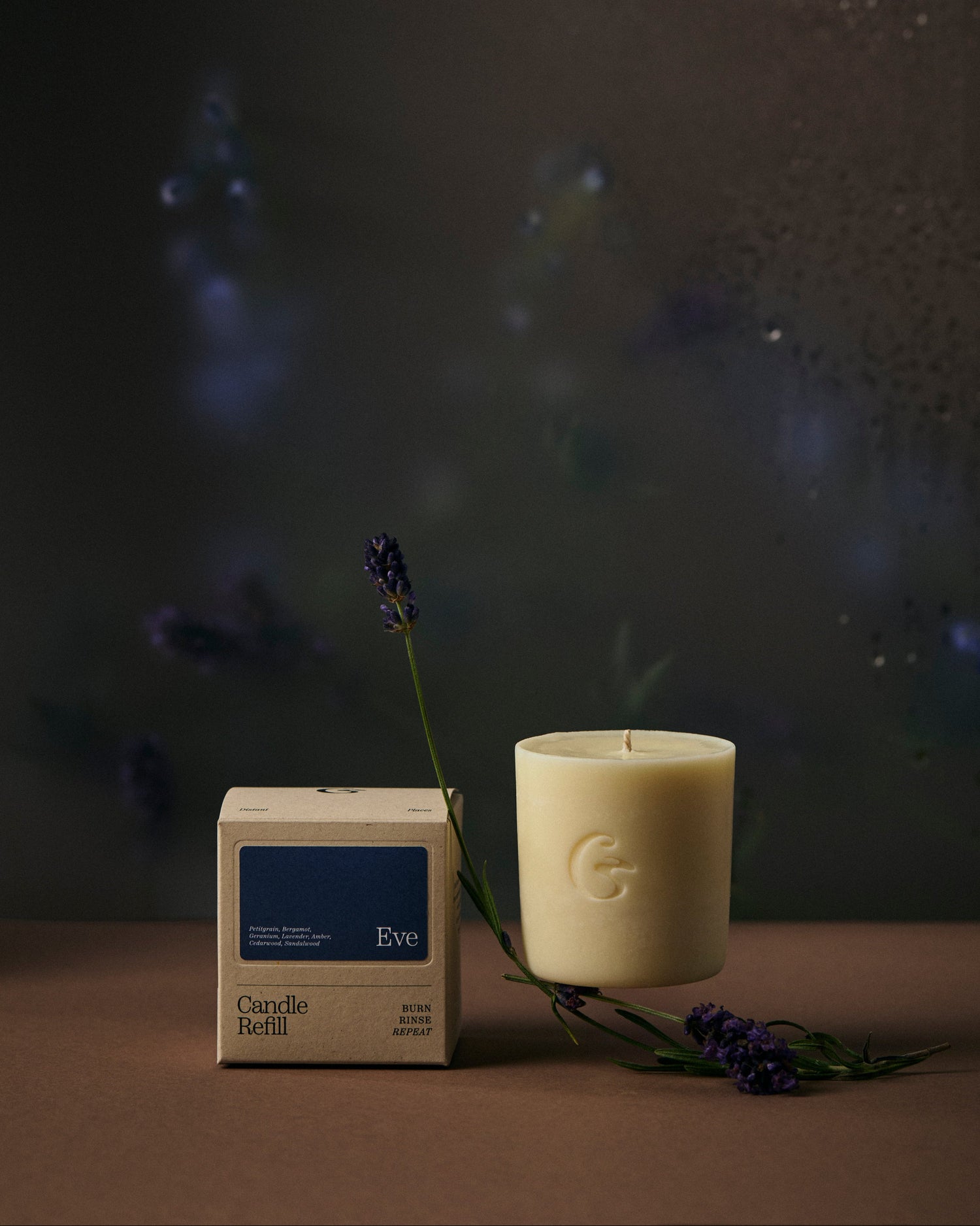 Candle refill  and packaging with lavender on a dark background
