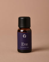 Bottle of Eve oil blend on a beige background
