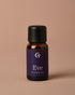 Bottle of Eve oil blend on a beige background