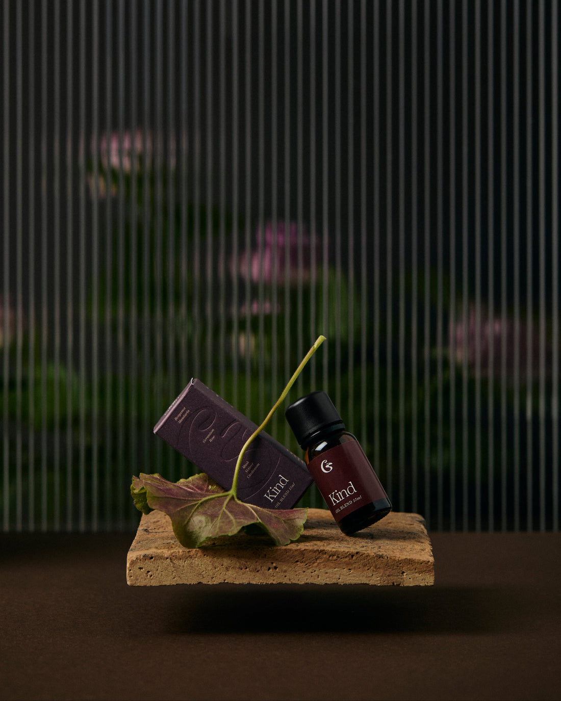 A bottle of essential oil and a box both names &