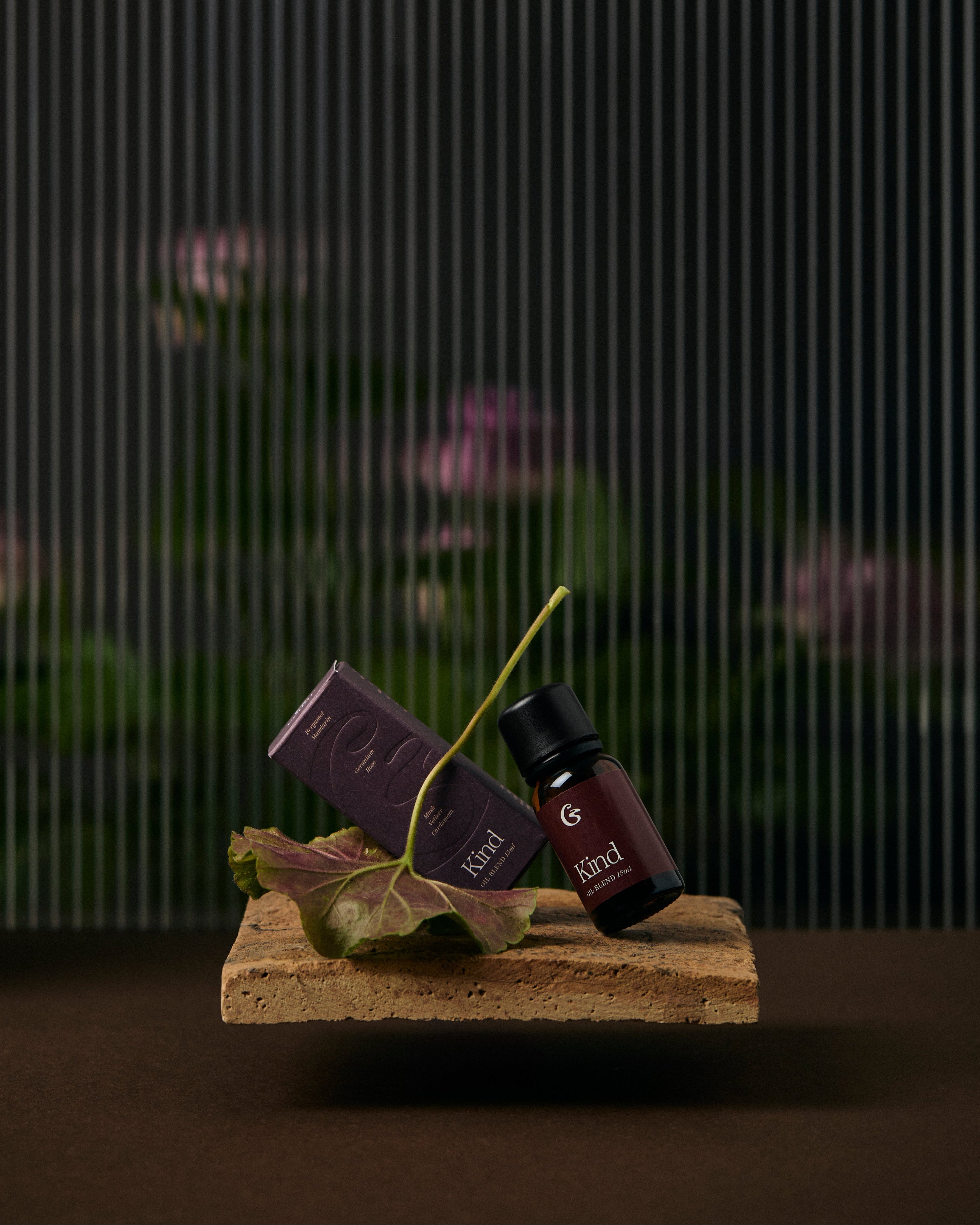 A bottle of essential oil and a box both names &