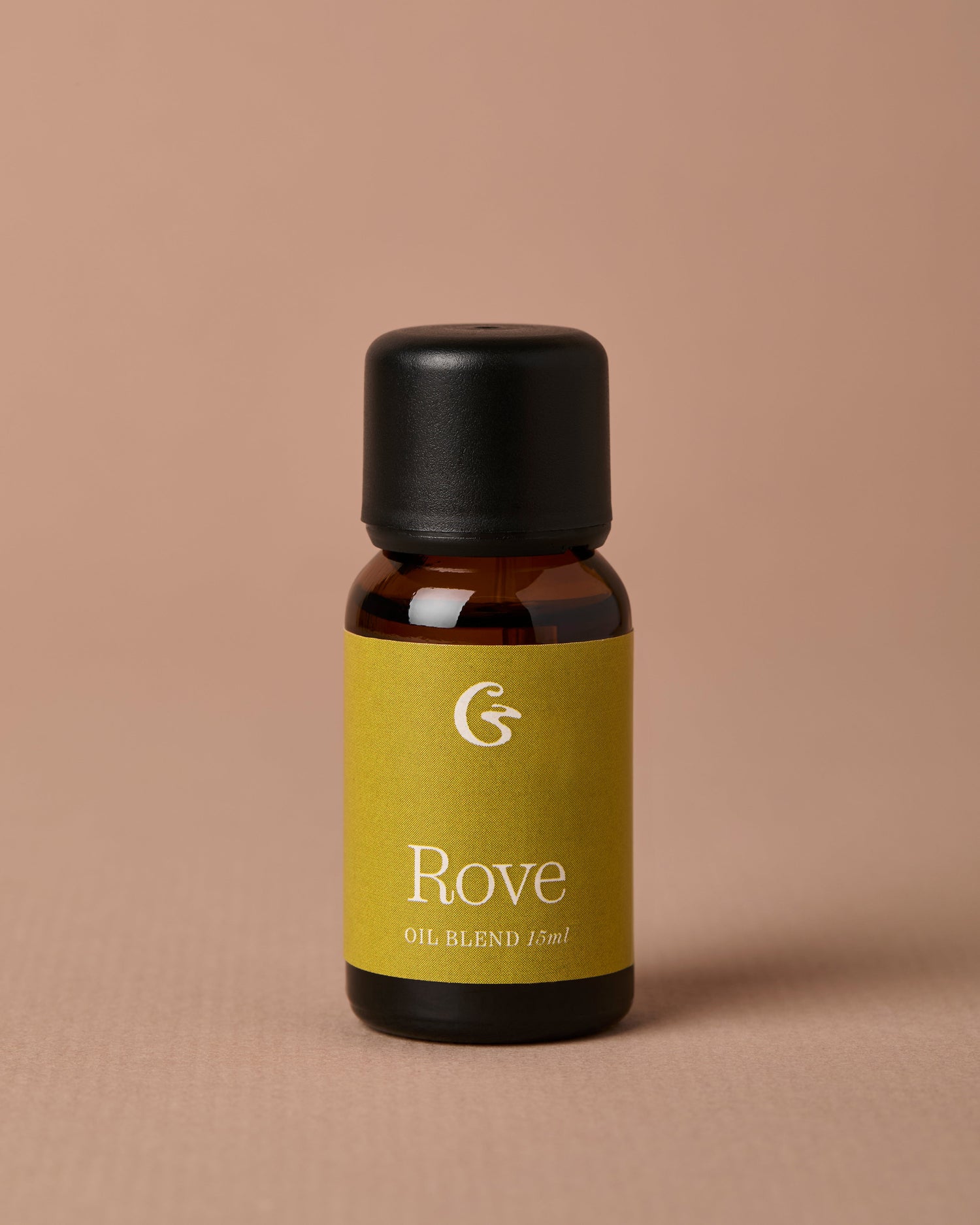 Bottle of Rove oil blend on a beige background