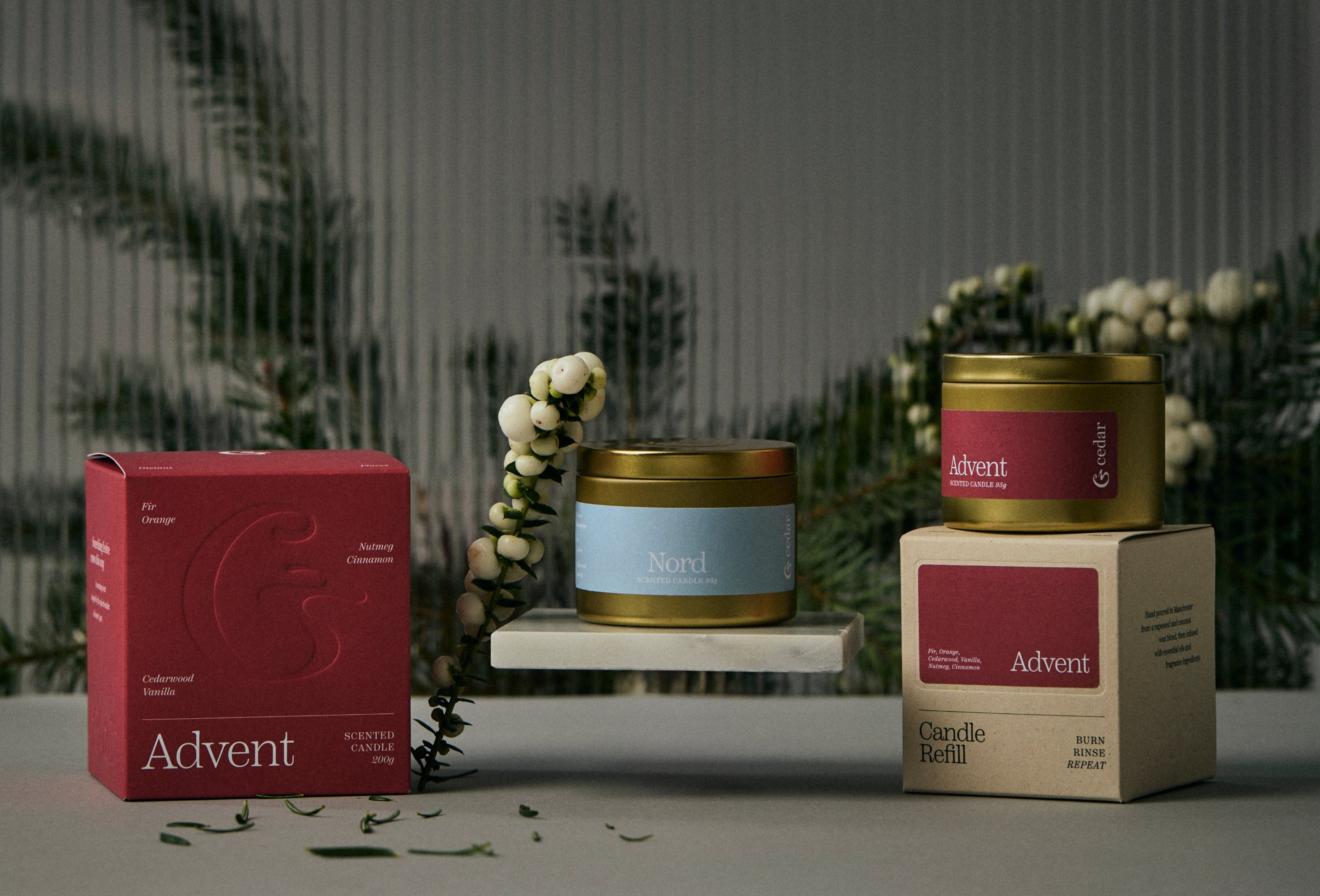 Candle and packaging with 'Nord' branding on a neutral background